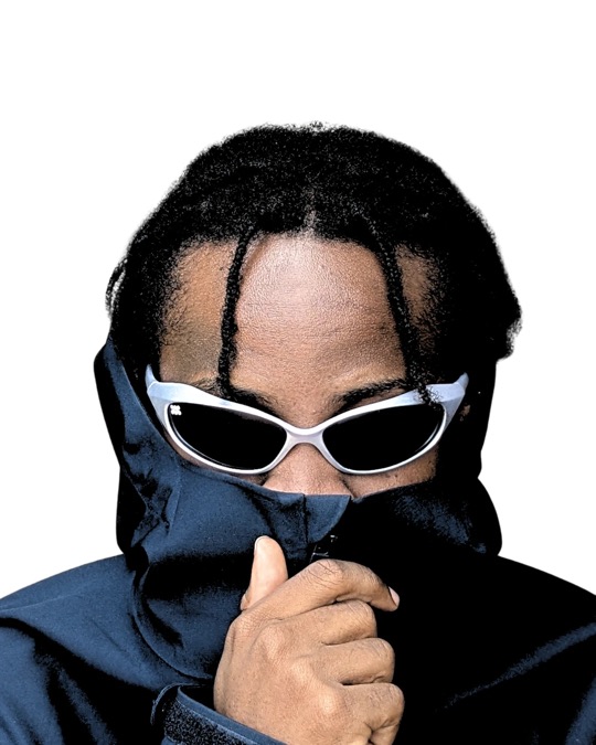 Man in a dark blue jacket pulled up to his nose, wearing the Gray Edition, against a white background.
